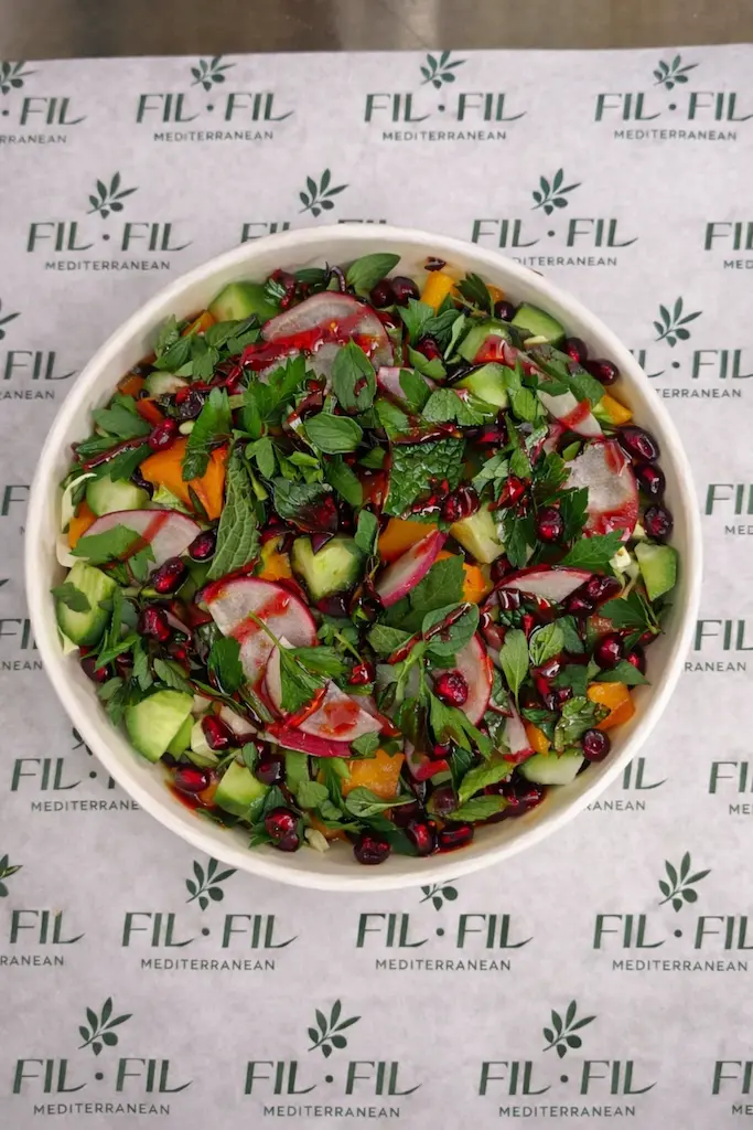 Deluxe salad with romaine, herbs and pomegranate vinaigrette at Fil Fil Mediterranean in Homer Glen, IL.