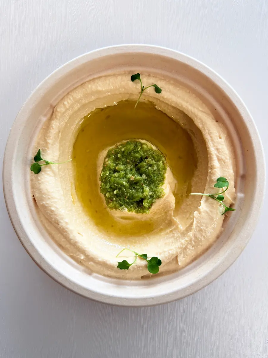 House-made hummus with tahini and olive oil at Fil Fil Mediterranean in Homer Glen, IL.