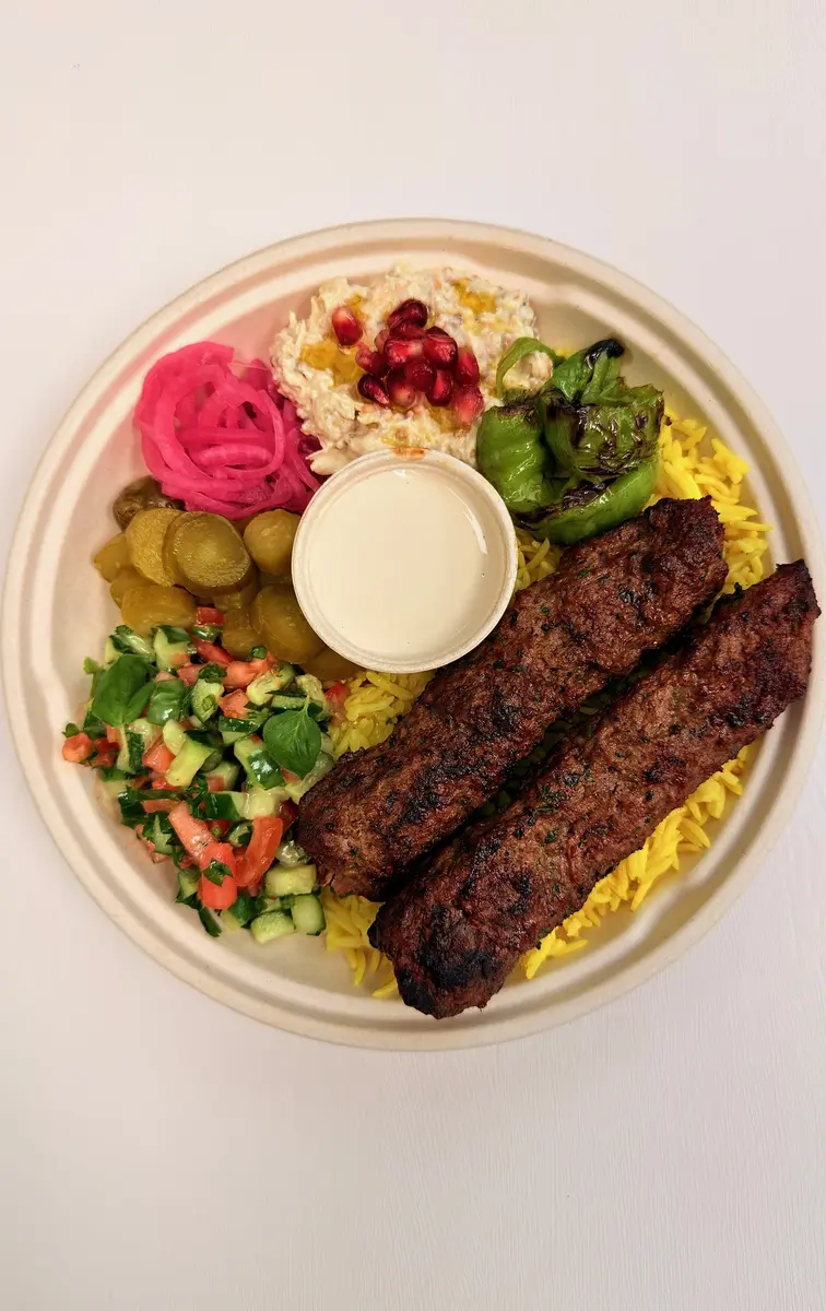 Kefta kebab rice bowl with baba ghanoush and lemon tahini at Fil Fil Mediterranean in Homer Glen, IL.