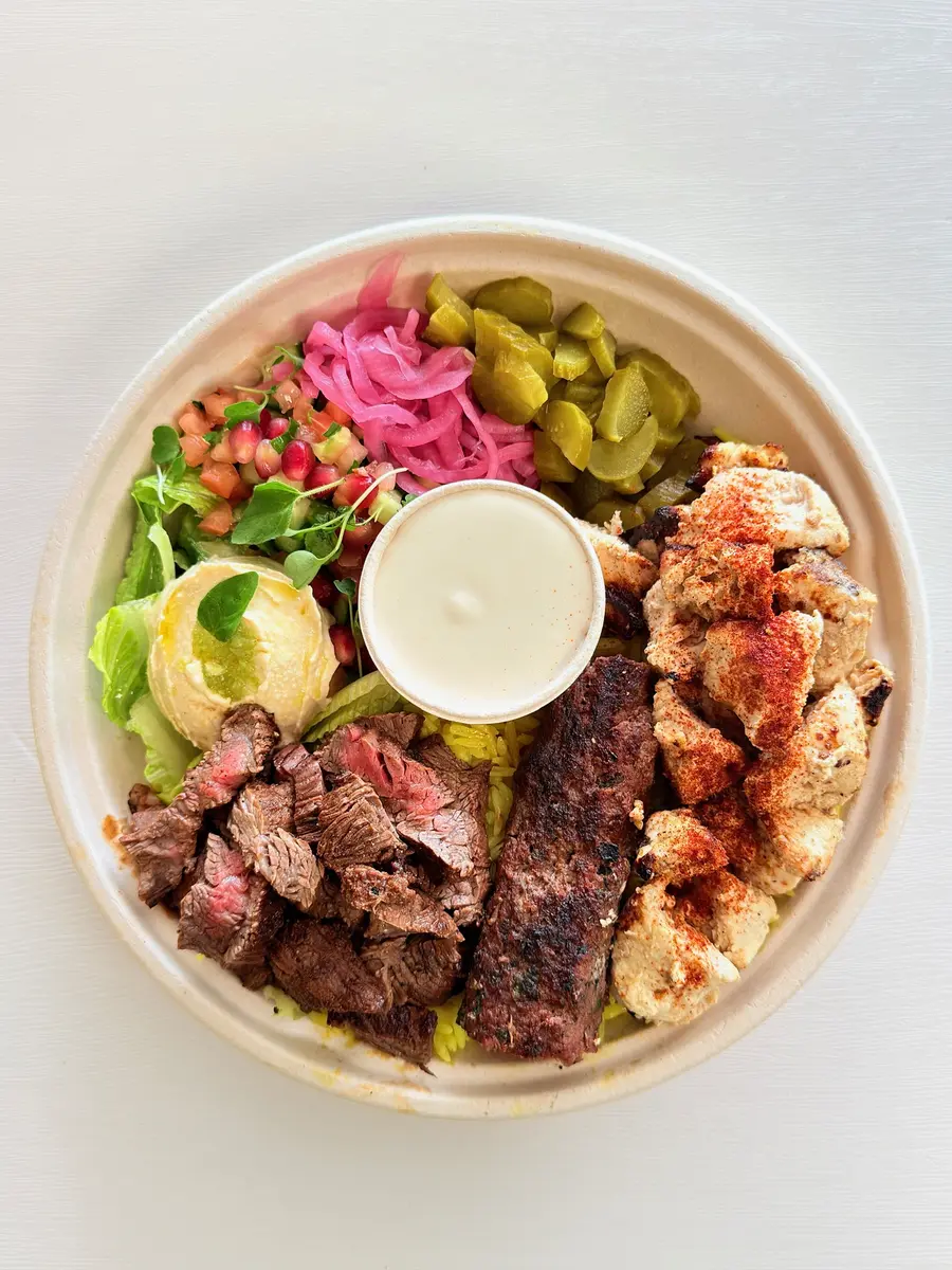 Mixed plate with skirt steak, chicken taouk and kefta kebab over yellow rice at Fil Fil Mediterranean in Homer Glen, IL.